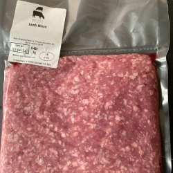 A pack of lamb mince from Red Down Beef and Lamb on a black background.