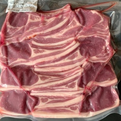 A pack of 8 lamb loin cutlets from Red Down Beef and Lamb on a black background.