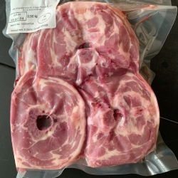 A pack of lamb neck slices from Red Down Beef and Lamb on a black background.
